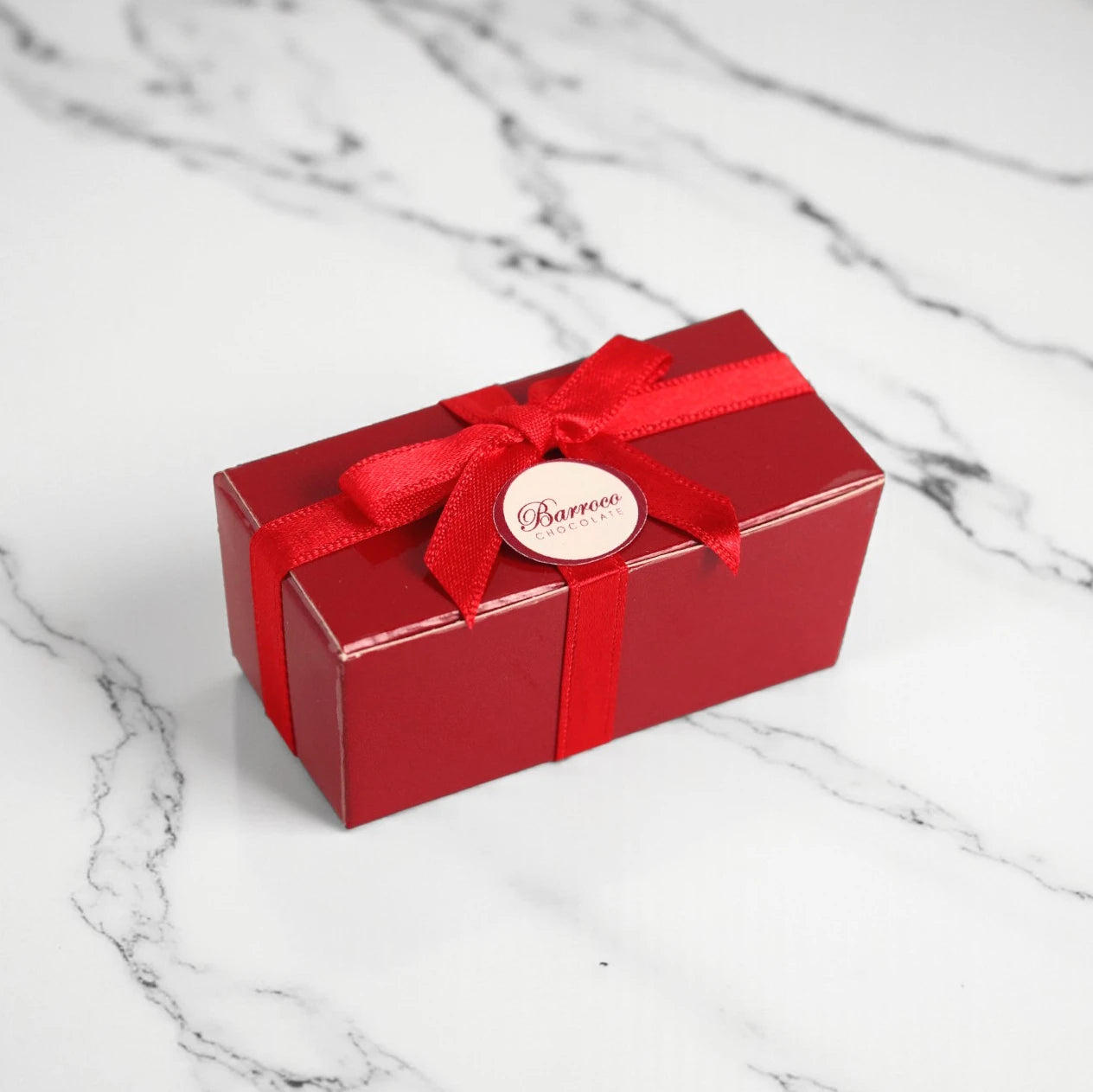 Caja souvenir roja de 2 bombones